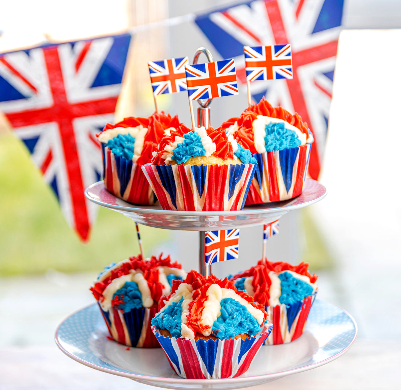 Spooning Vanilla cupcake mixture into cupcake cases. UK Stock Photo - Alamy